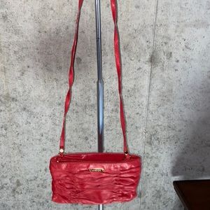 Michael Kors red leather ruched cross body.